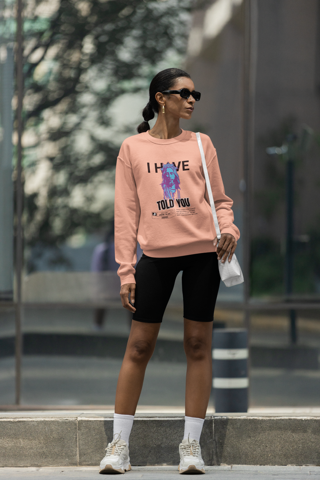 female wearing Unisex Sweatshirt John 16:33